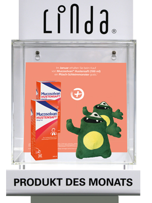Ausstellungsbox von LINDA Apotheken mit dem „Produkt des Monats“, einer Hustensaftpackung und einem Plüschmonster.
